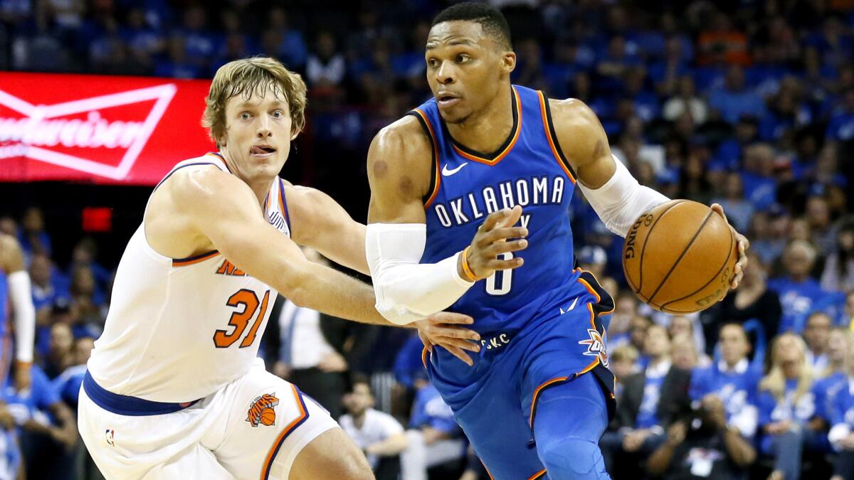 Thunder guard Russell Westbrook drives around Knicks guard Ron Baker during the fourth quarter Thursday.