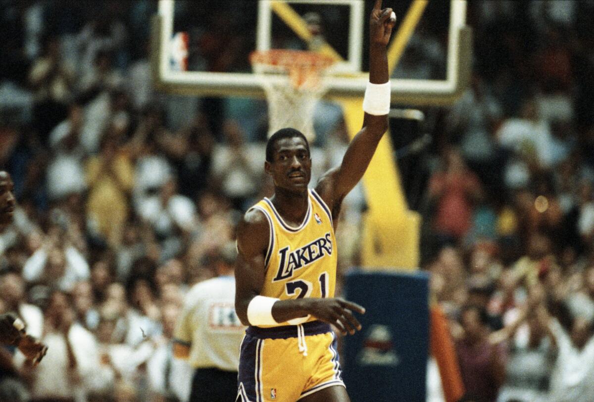 Lakers forward Michael Cooper raises his finger to signify the Lakers are No. 1.