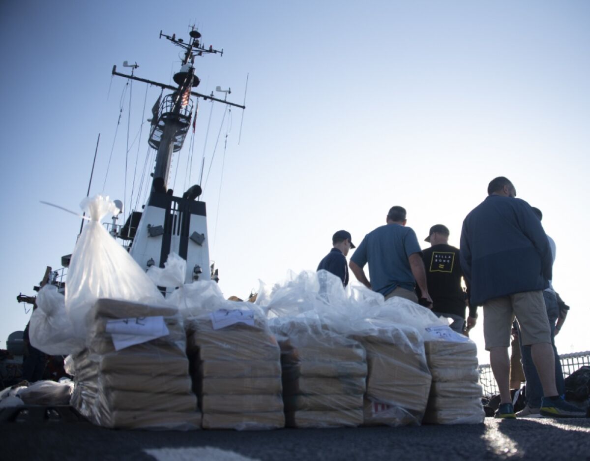 Bails of cocaine are prepared for offloading from the Coast Guard cutter Alert in San Diego on Wednesday.