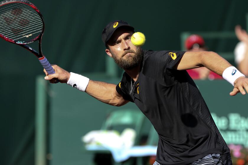 Steve Johnson, of the United States, hits a ball after defeating Jack Sock, of the United States, during the semifinals of the U.S. Men's Clay Court Championship tennis tournament at River Oaks Country Club on Saturday, April 15, 2017, in Houston. (Yi-Chin Lee / Houston Chronicle via AP)