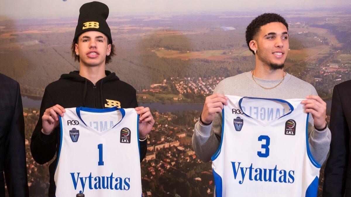 During a Jan. 5 news conference in Prienai, Lithuania, LiAngelo Ball, right, and brother LaMelo show their jerseys after signing with Vytautas Prienai