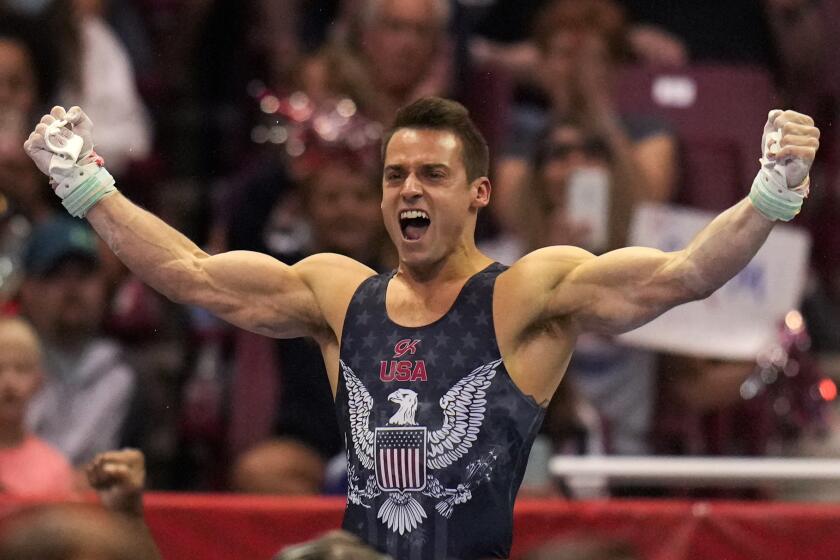 Sam Mikulak celebrates his performance on the still rings during the men's U.S. Olympic Gymnastics Trials Saturday, June 26, 2021, in St. Louis. (AP Photo/Jeff Roberson)