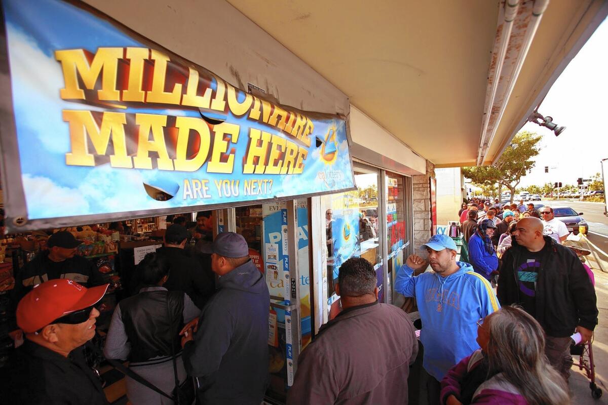 A crowd lines up to buy Powerball lottery tickets at Bluebird Liquor in Hawthorne earlier this month.