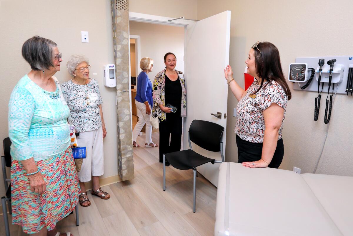 Erin Gospodarec gives a tour of the exam room at the TrueCare & Lennar Foundation Health Center in San Marcos.