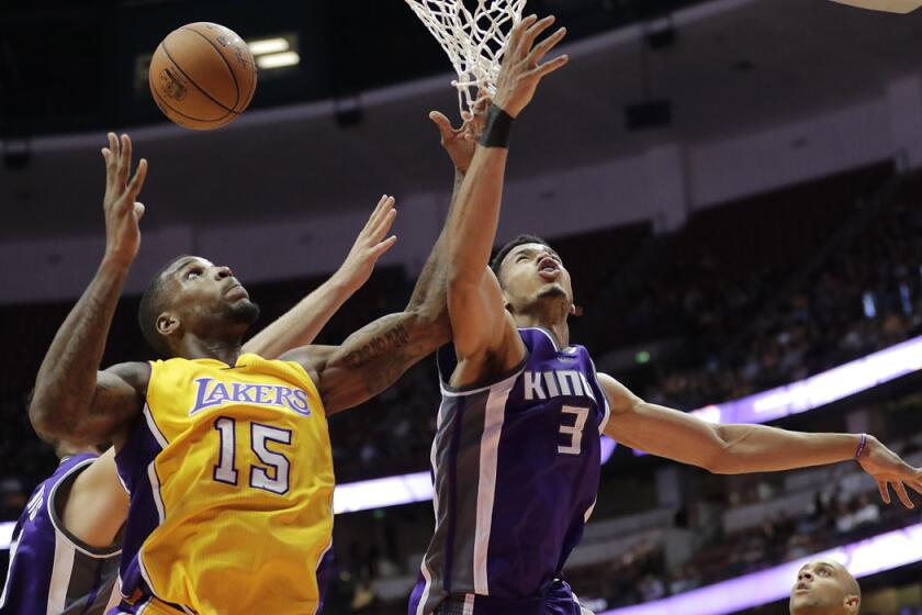 Lakers' Thomas Robinson, left, and Sacramento Kings' Skal Labissiere fight for a rebound during the second half of a preseason game on Oct. 4.