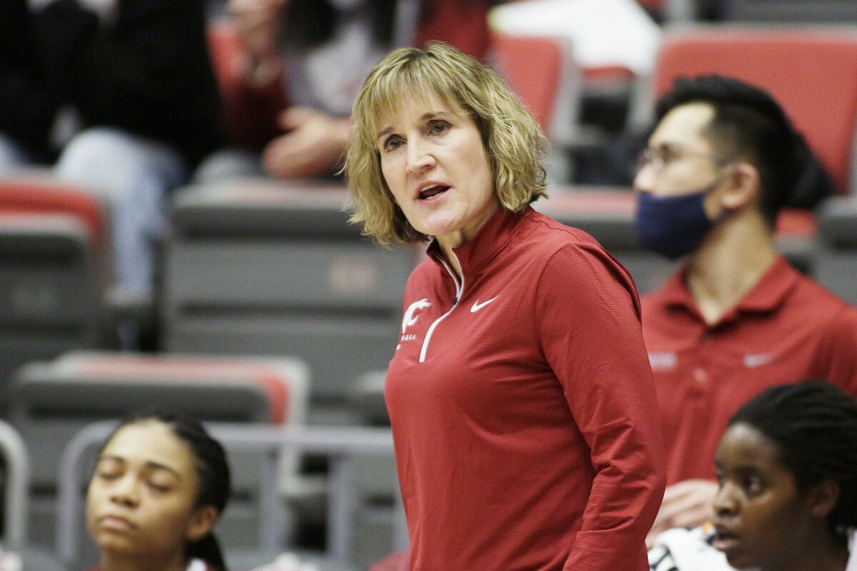 Washington State head coach Kamie Ethridge directs her team during the first half of an NCAA college basketball game against Stanford, Sunday, Jan. 2, 2022, in Pullman, Wash. (AP Photo/Young Kwak)