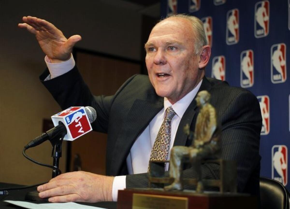 Former Denver Nuggets Coach George Karl accepts the award for coach of the year back in May.