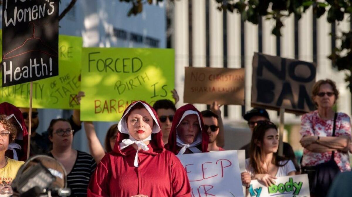 Demonstrators rally outside the Alabama State House in Montgomery on May 14 against a bill to criminalize nearly all abortions in the state.