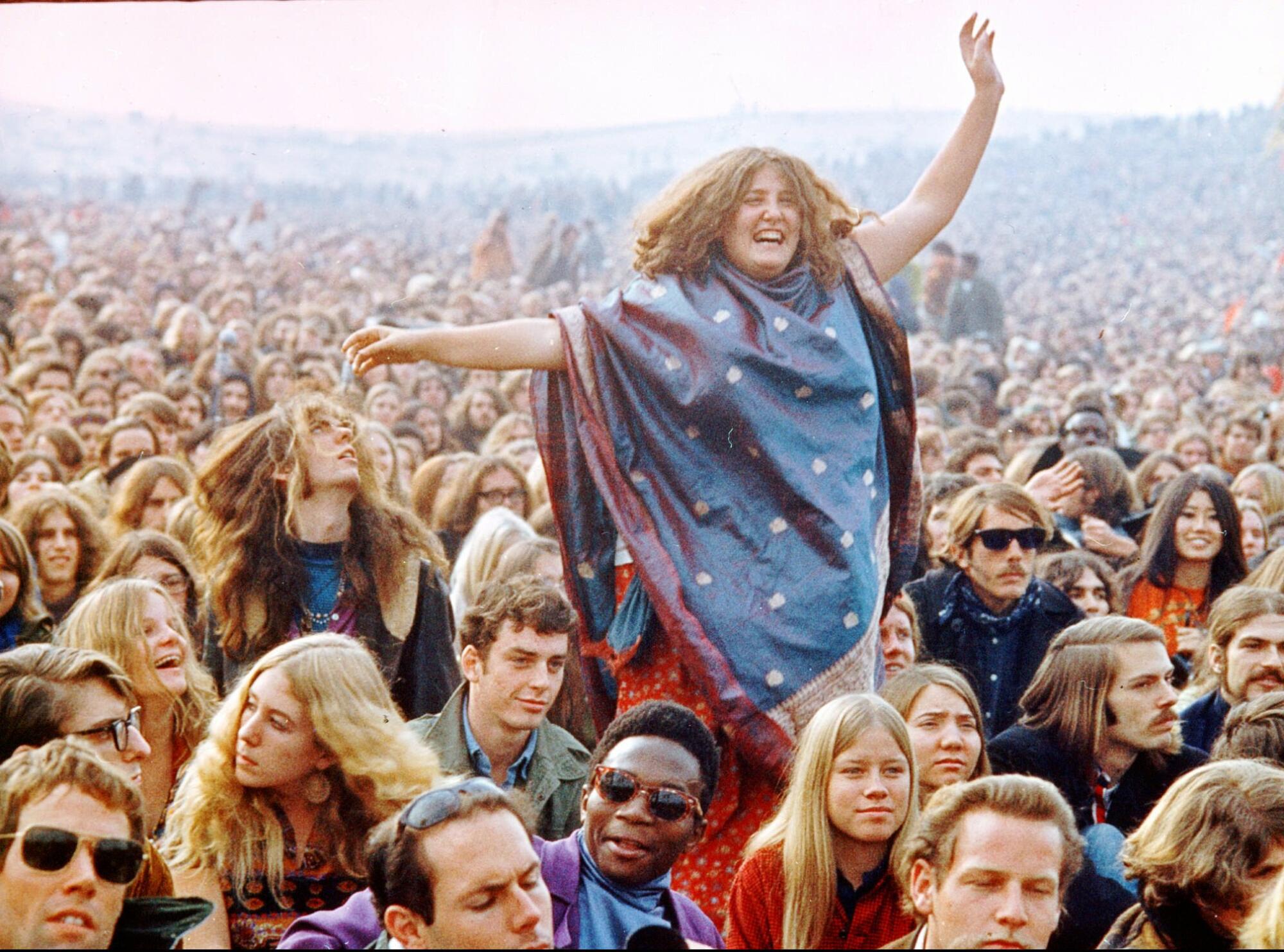 A woman is seen in the crowd at a concert at the Altamont racetrack in Livermore, Calif., on Dec. 6, 1969.