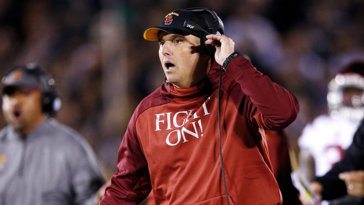 USC interim Coach Clay Helton reacts to a play during the Notre Dame loss on Saturday.