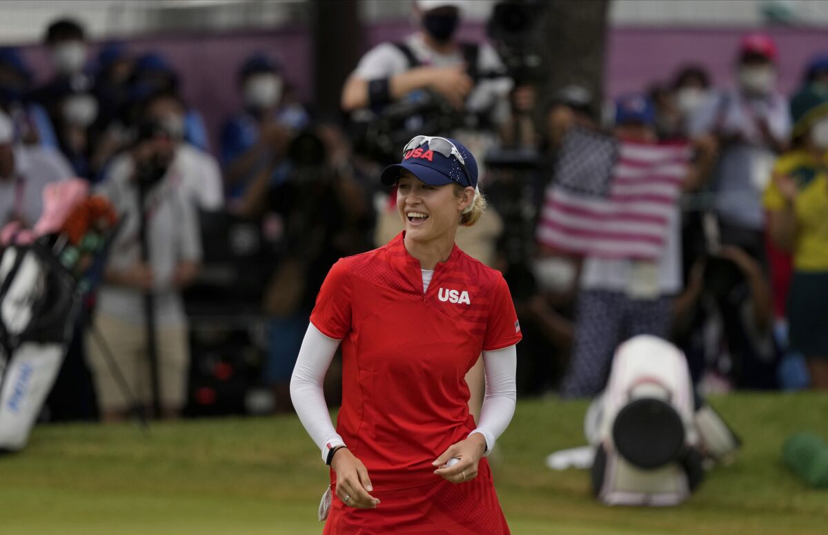 U.S. golfer Nelly Korda smiles after winning the gold medal.