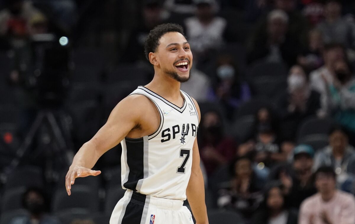 San Antonio Spurs guard Bryn Forbes (7) reacts to a score against the Houston Rockets during the second half of an NBA basketball game, Wednesday, Jan. 12, 2022, in San Antonio. (AP Photo/Eric Gay)