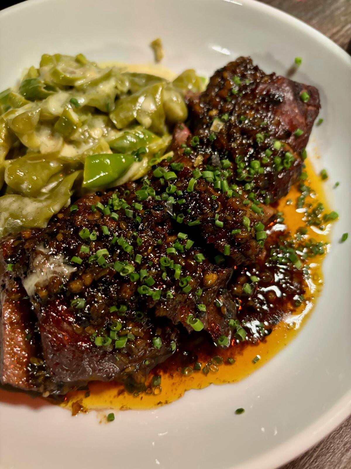 Hanger steak with shisito peppers in koji, sesame seed and aleppo at Darkroom in Santa Ana.