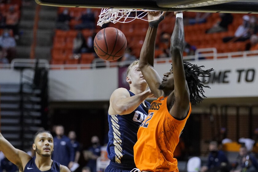Cunningham outduels Abmas, Oklahoma St. beats Oral Roberts ...