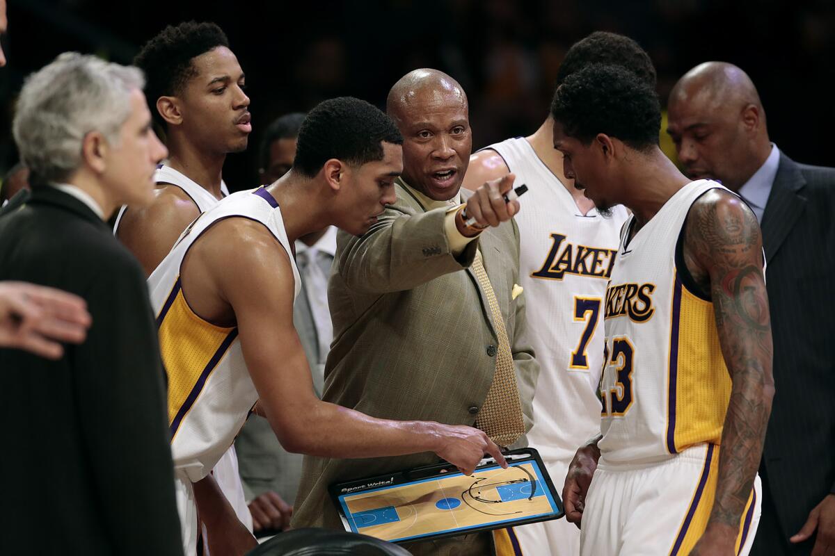 Lakers Coach Byron Scott instructs his players on how to approch the last minute, while down by 10 points to the Jazz during a game at Staples Center on Jan. 10.