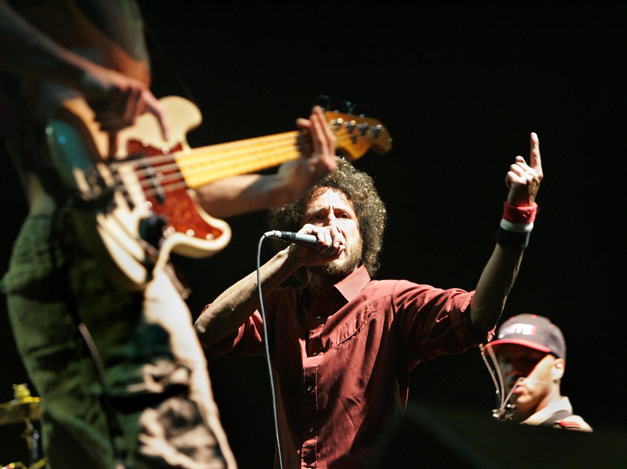 Rage Against The Machine's , Zack de la Rocha, center, performs during finale of the 8th annual Coachella Valley Music and Arts Festival. Sunday, April 29, 2007.