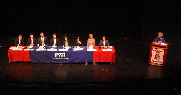 Candidates, from left, Dan Jeffries, Kevork Kurdoghlian, David Sagal, Ian Mirisola, Karyn Riel, Kaitzer Puglia, Jennifer Rubendall, and Joel Peterson at a candidates forum for the La Cañada Unified School District board at La Cañada High School on Tuesday, Oct. 1, 2013. There are 8 candidates running for three open seats.