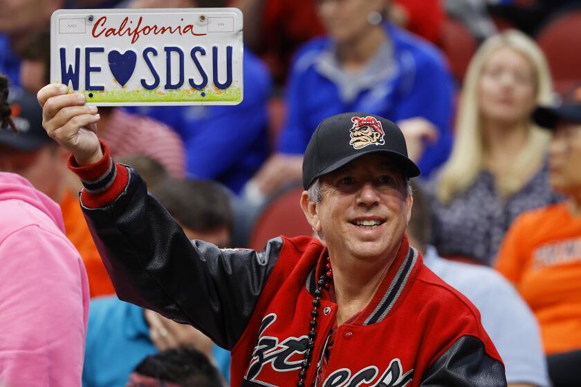 A San Diego State fan celebrates during a win against Alabama in a Sweet 16 game in the NCAA Tournament.