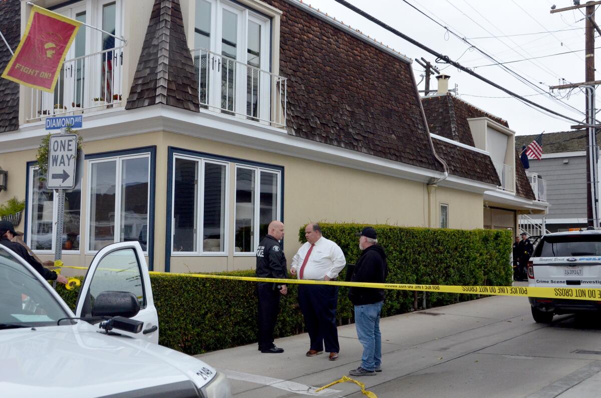 Three people were found dead in the back apartment of this Diamond Avenue building on Balboa Island Monday morning. 