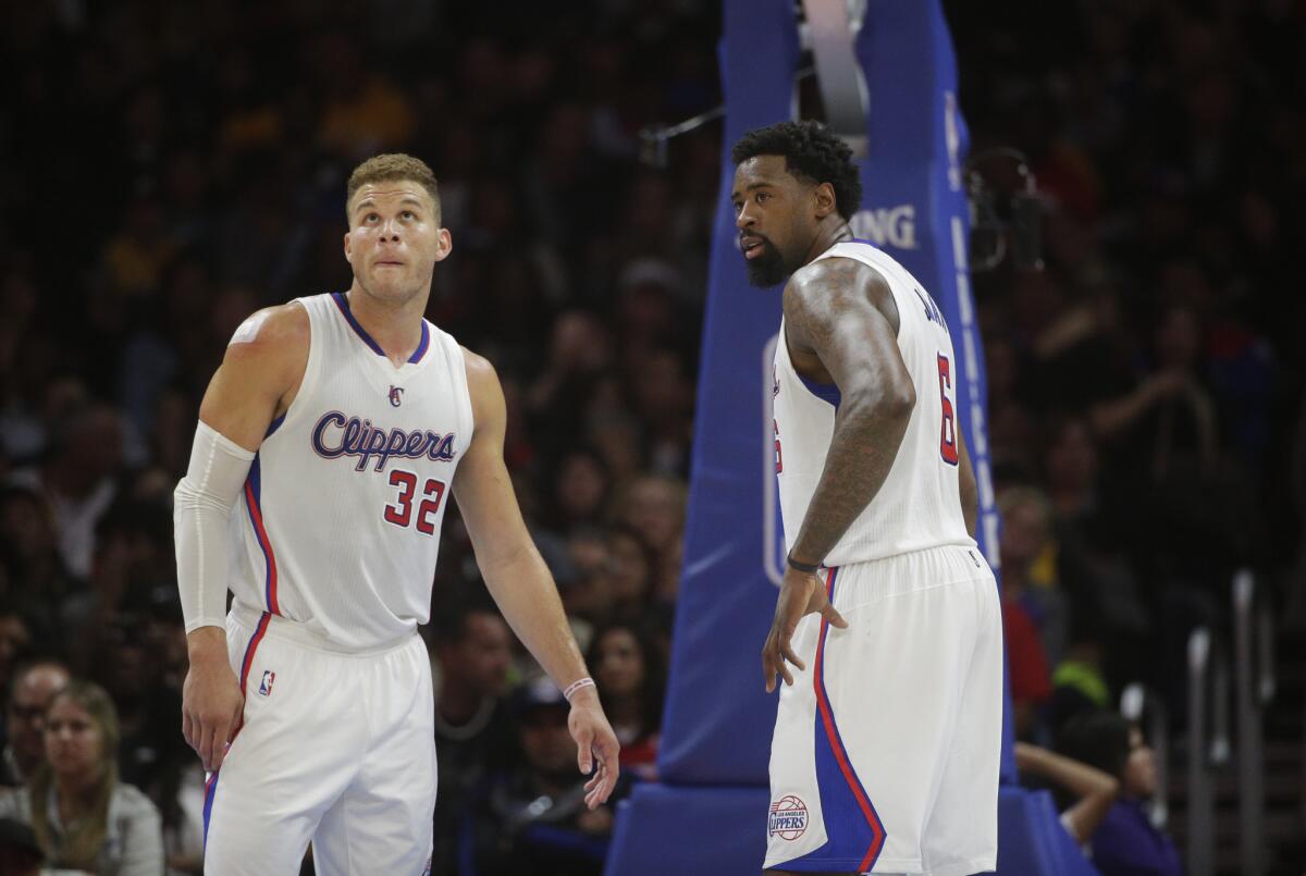 Blake Griffin and DeAndre Jordan stand on the court as the Clippers play the Lakers at Staples Center on April 7.