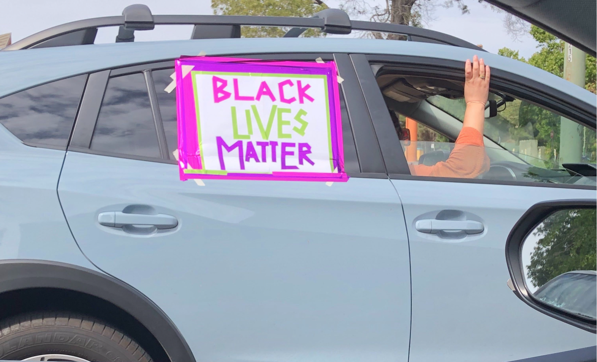 A car participates in a caravan protest Sunday in Oakland.