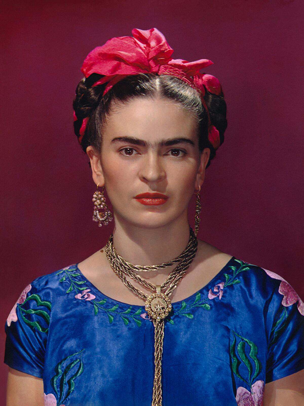 "Frida with Blue Satin Blouse," a 1939 photograph of Frida Kahlo. 