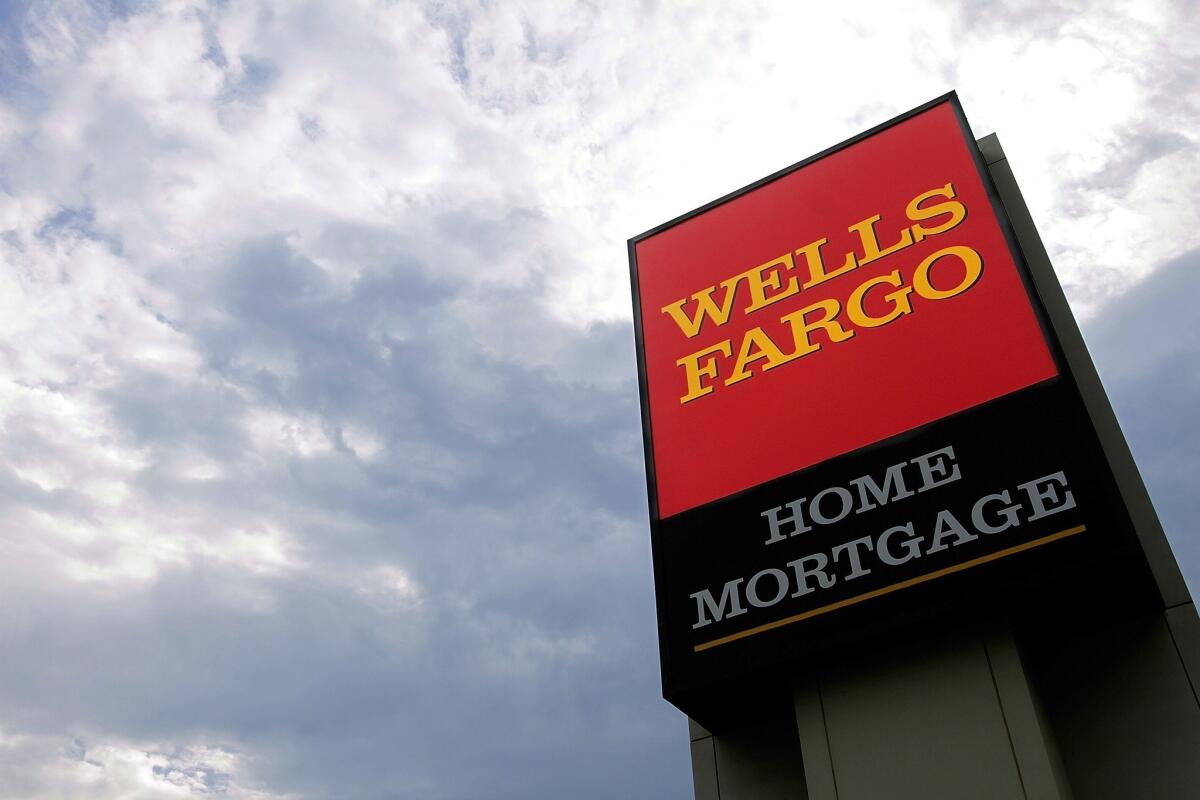A Wells Fargo logo is displayed on a sign outside one of the company's office buildings in Springfield, Ill.