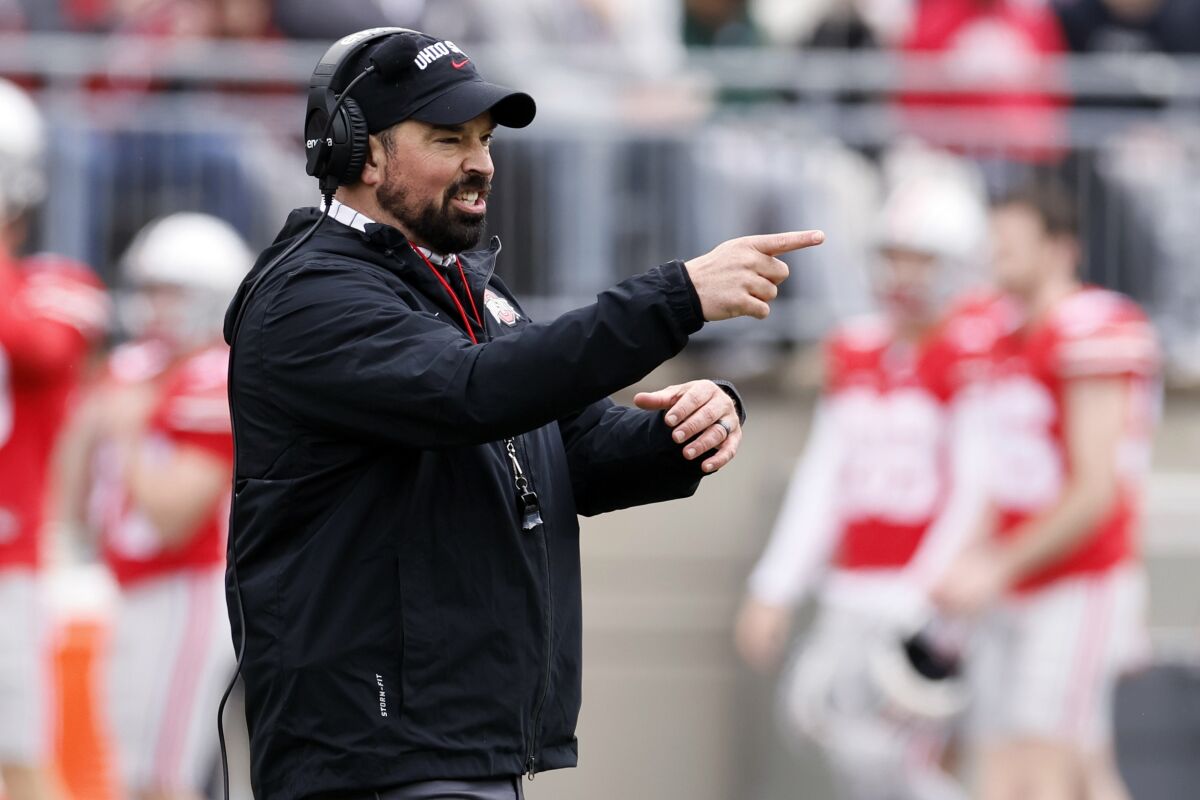 FILE - Ohio State head coach Ryan Day directs his team during an NCAA college spring football game on April 16, 2022, in Columbus, Ohio. Ohio State is hiking Day's annual salary to $9.5 million, as part of a two-year contract extension that will put him among the nation's highest-paid college football coaches. (AP Photo/Jay LaPrete, File)