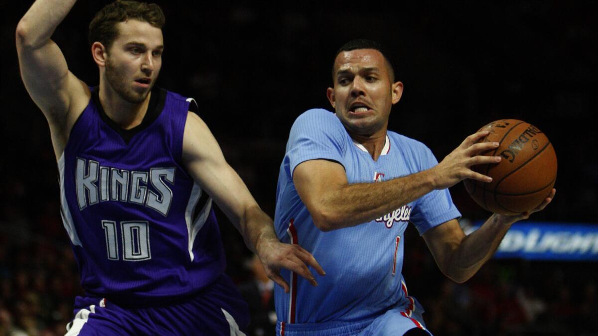 Clippers guard Jordan Farmar, right, tries to drive past Sacramento Kings guard Nik Stauskas during the Clippers' 98-92 loss at Staples Center on Nov. 2.