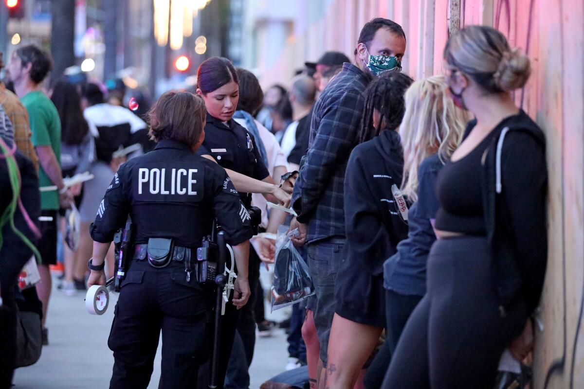 Los Angeles police officers gear up during protests that have rocked the city after the death of George Floyd in Minneapolis.