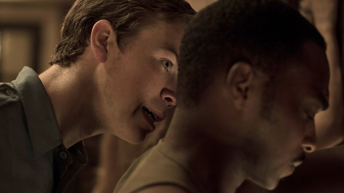 Will Poulter, left, and Anthony Mackie in the film "Detroit."