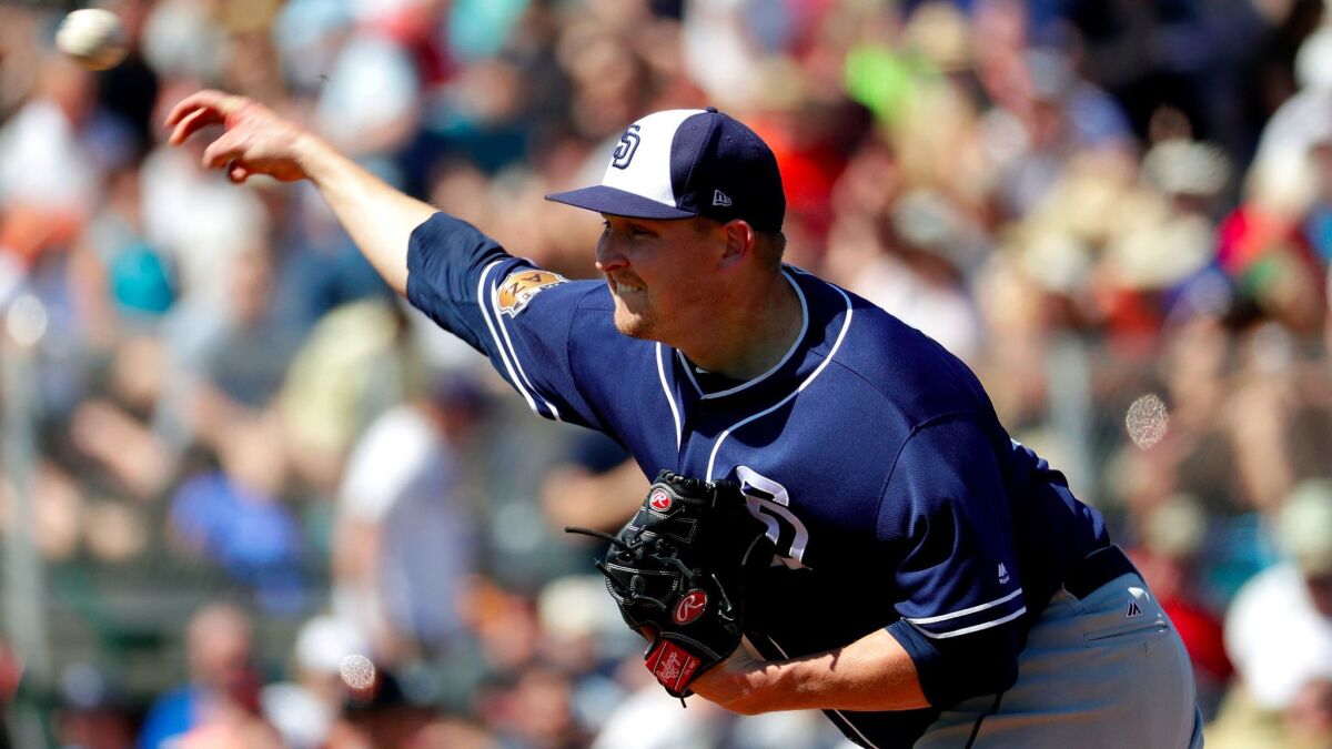 San Diego Padres starting pitcher Trevor Cahill throws against the San Francisco Giants during the first inning of a spring training baseball game, Tuesday, March 21, 2017, in Scottsdale, Ariz.