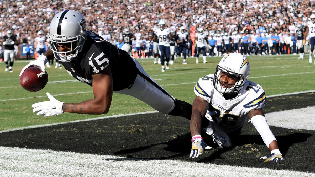 Raiders receiver Michael Crabtree scores on a 21-yard pass against Chargers cornerback Casey Hayward.