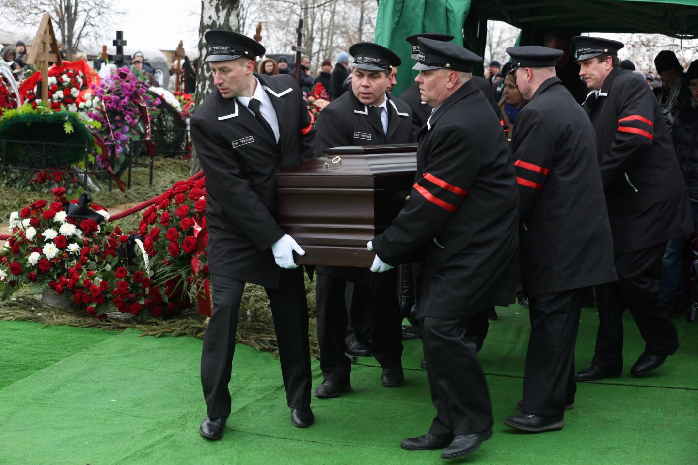 Boris Nemtsov's casket is carried to his grave Tuesday at a Moscow cemetery.