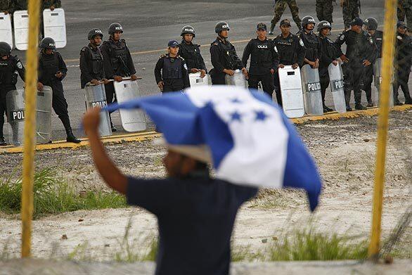 Honduras soldiers surround airport