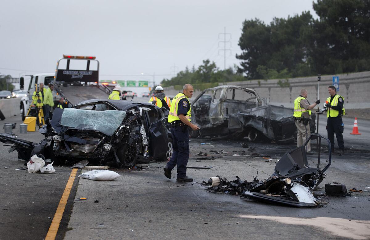 Investigators examine the scene of a deadly crash in April 2015 on U.S. Route 50 in Sacramento. Fatal crashes increased 20% in California during the first half of this year and 14% nationwide.