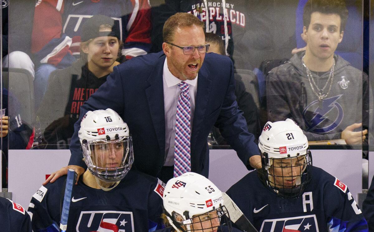 FILE - U.S.head coach Joel Johnson reacts during the third period of a women's hockey game against the Canada, Friday, Oct. 22, 2021, in Allentown, Pa. In April 2021, he was promoted to become the U.S. women’s national hockey team coach following Bob Corkum’s abrupt resignation over COVID-19 protocols at the world championships. In June, Johnson was hired by St. Thomas University in St. Paul, Minnesota, to lead its women’s hockey program making the jump to the Division I level .(AP Photo/Chris Szagola, File)