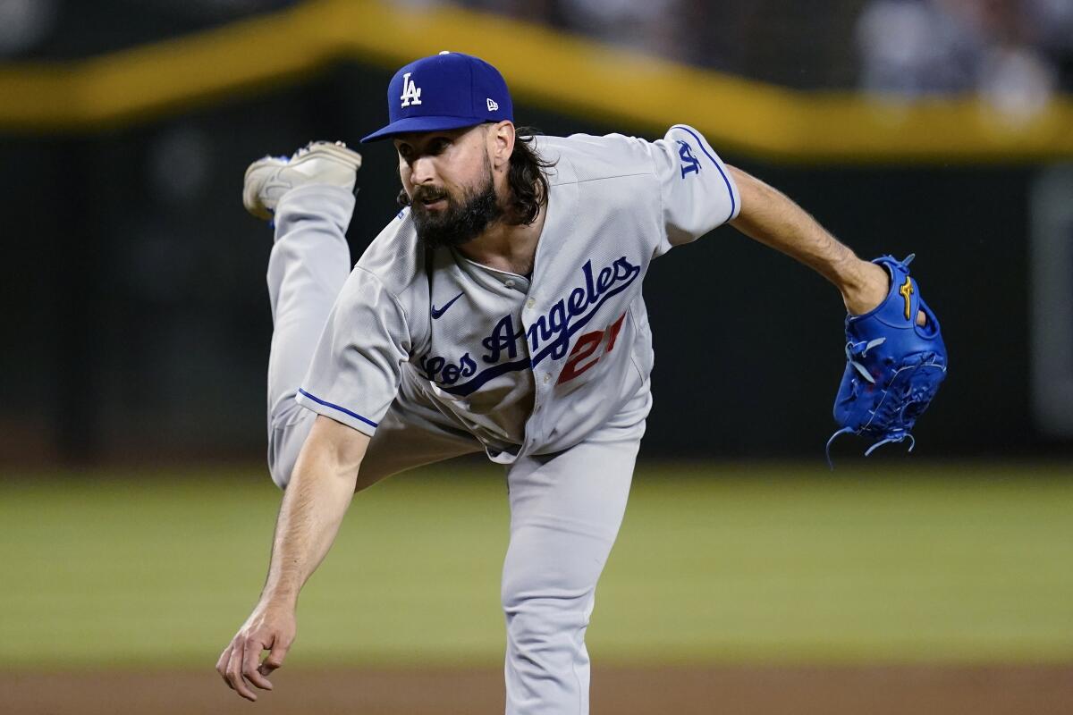 Dodgers pitcher Tony Gonsolin follows through with his motion after throwing to an Arizona Diamondbacks batter.