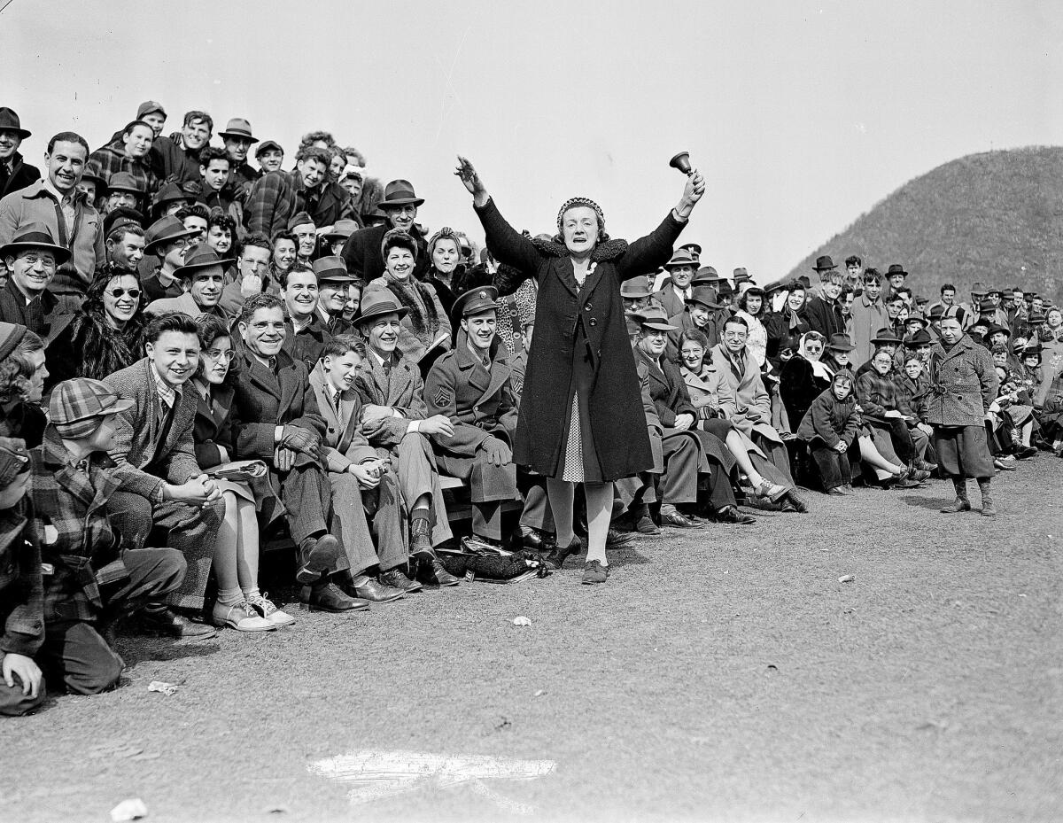Hilda Chester, the Brooklyn Dodgers' self-styled No. 1 fan, rings a bell before a crowd of fans in Bear Mountain, N.Y. during an exhibition game on March 29, 1943.