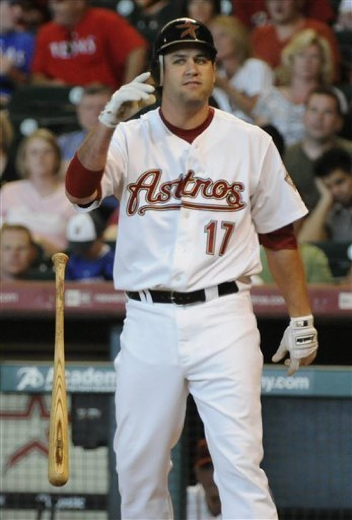 Houston Astros' Lance Berkman walks off the field after striking