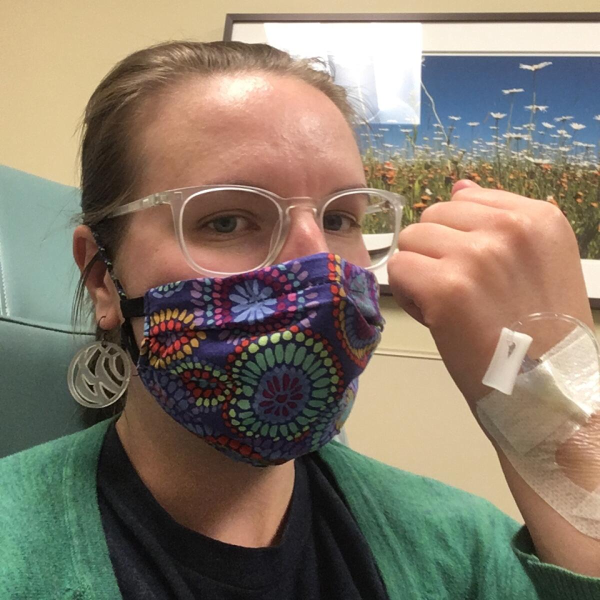 Britta Bloomquist receives an infusion to treat a rare type of arthritis