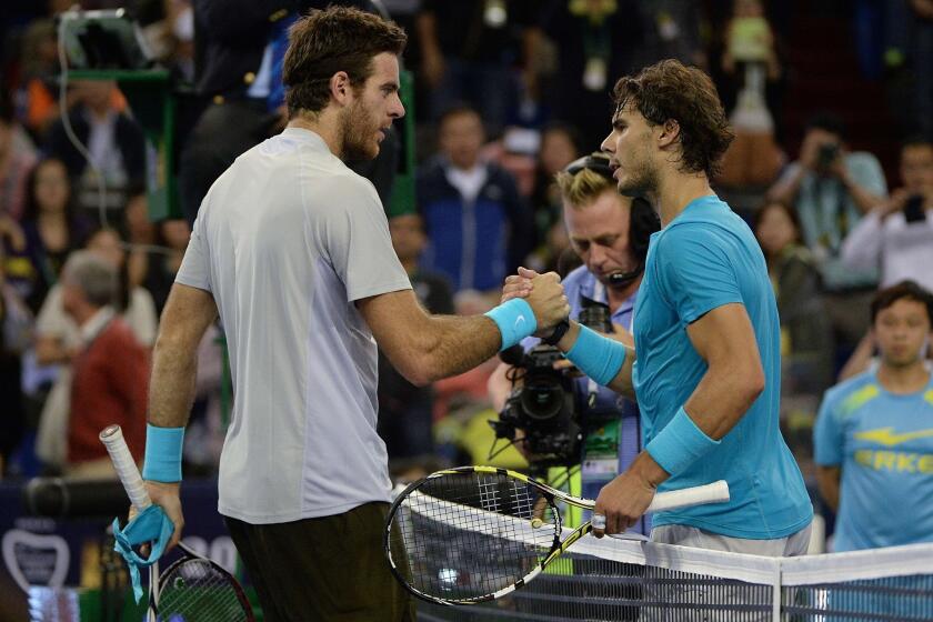 Juan Martin del Potro, left, is congratulated by Rafael Nadal after a straight-set victory in the Shanghai Masters on Saturday.