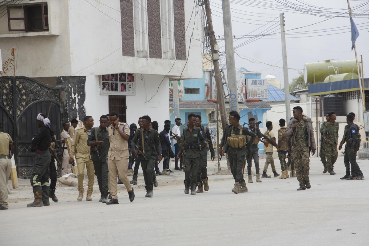 Soldiers patrol outside the Hayat Hotel in Mogadishu, Somalia, Saturday Aug, 20, 2022. At least 10 people were killed in an attack by Islamic militants who stormed the hotel in Somalia's capital late Friday, police and eyewitnesses said. Several other people were injured and security forces rescued many others, including children, from the scene of the attack at Mogadishu's Hayat Hotel. (AP Photo/Farah Abdi Warsameh)