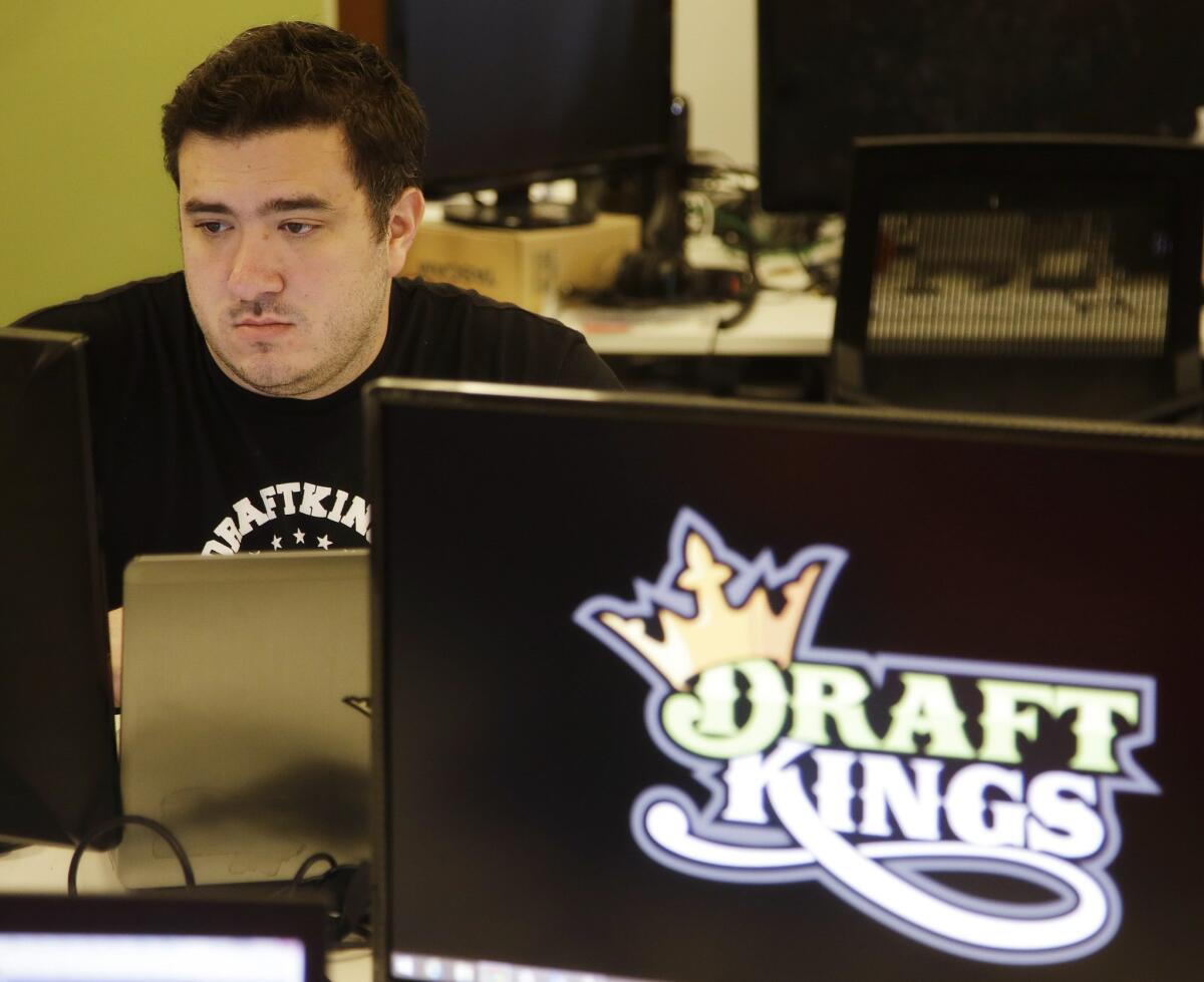 Len Don Diego, marketing manager for content at DraftKings, works at his station at the company's offices in Boston on Sept. 9.