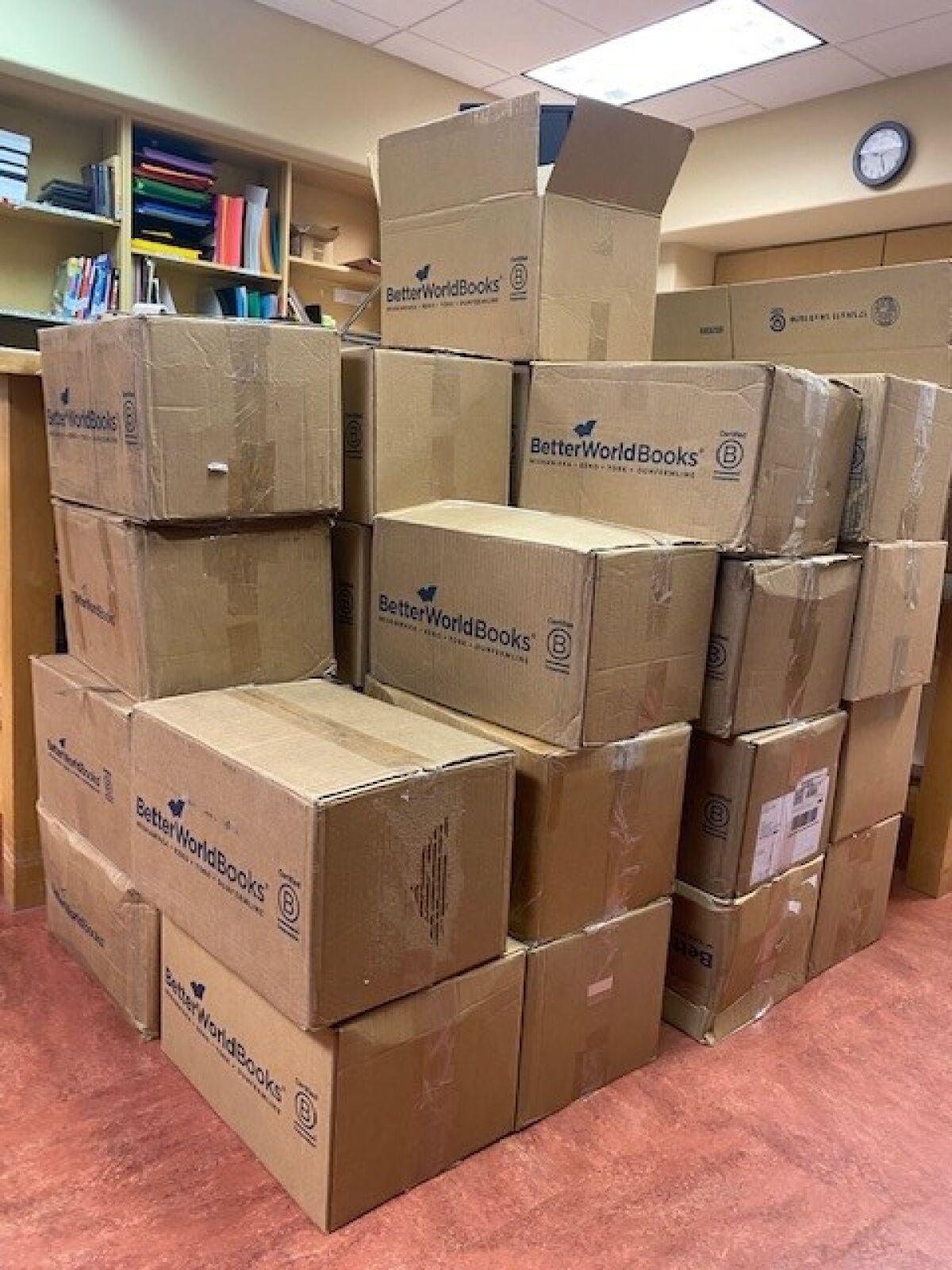 Boxes full of books withdrawn from the La Jolla/Riford Library collection await shipment to Better World Books.