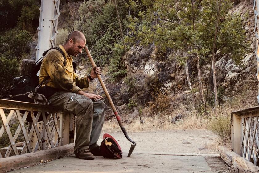 Captain Justin Grunewald takes a short rest amid his battle against the Willow Fire.