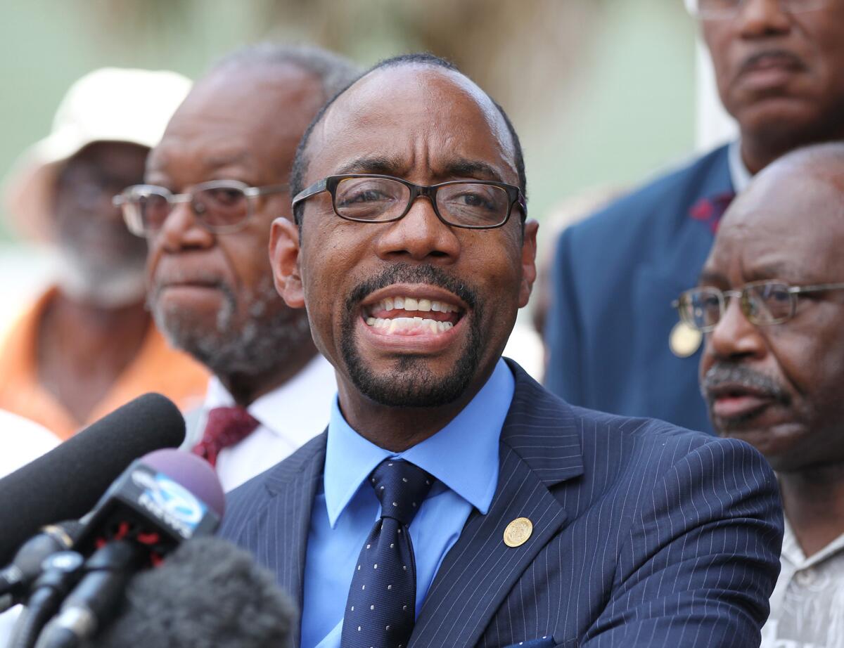 NAACP President Cornell William Brooks holds a news conference about the church killings on Friday.