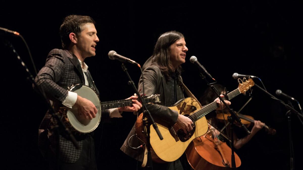 Scott, left, and Seth Avett of the Avett Brothers onstage at the premiere of "May It Last: A Portrait of the Avett Brothers" in New York in January.