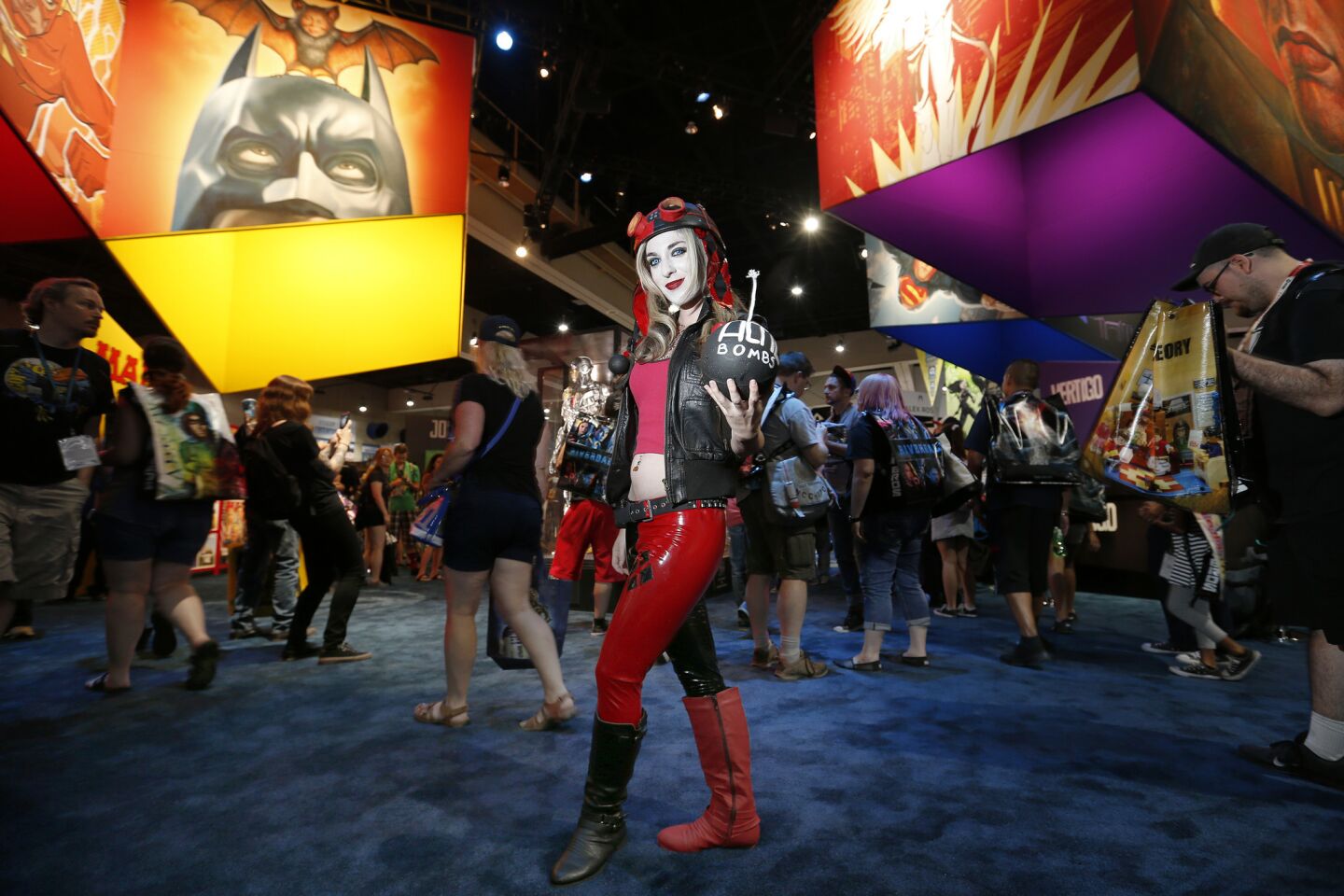 Amanda Levine of North Hollywood is dressed as Harley Quinn while viewing the DC Comics display.