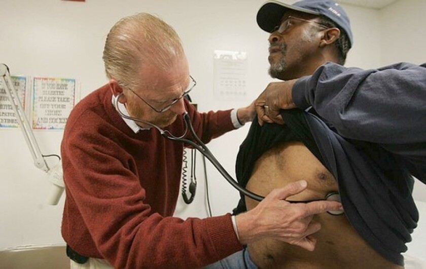 A doctor examines a patient